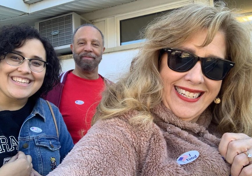 Sue serio with her husband and daughter